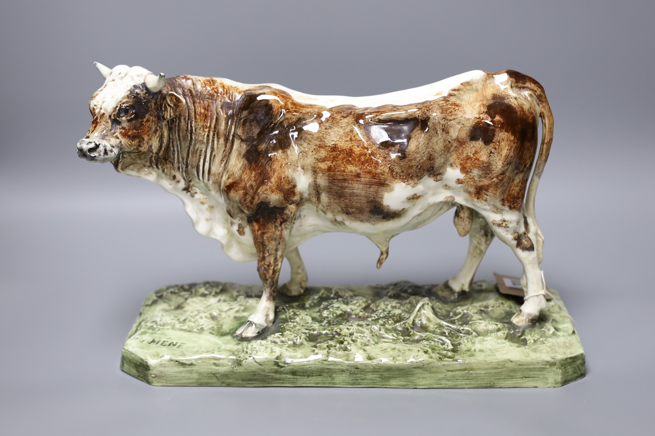 After Pierre Jules Mene (1810-1879) - a faience model of a bull, 'Taureau Normand', impressed signature, 35cm wide